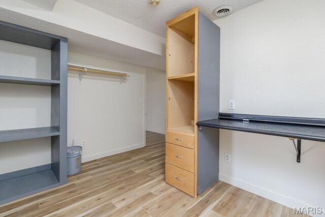 212 Tremont Dr, Waynesville, MO 65583 - walk in closet with light wood-type flooring