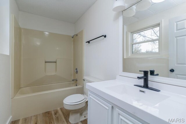 212 Tremont Dr, Waynesville, MO 65583 - bathroom featuring toilet, vanity, wood finished floors, and shower / bathtub combination