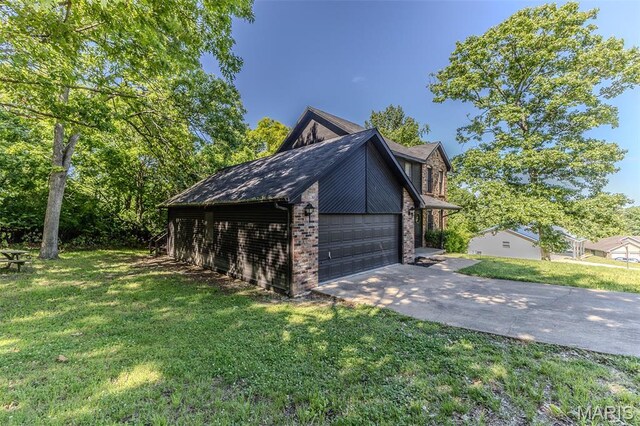212 Tremont Dr, Waynesville, MO 65583 - view of side of home with a yard, brick siding, and concrete driveway