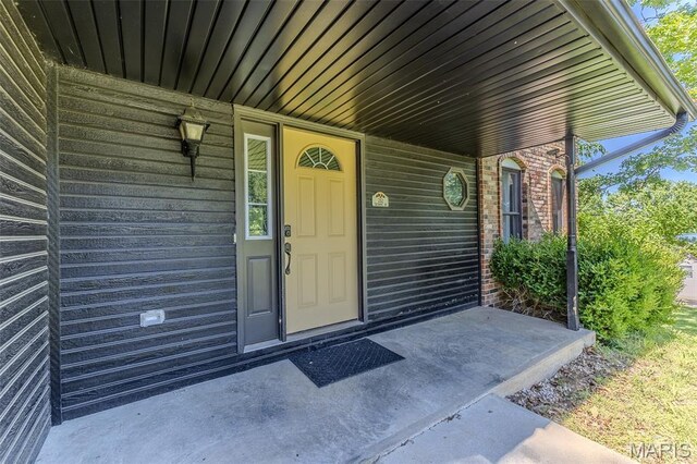 212 Tremont Dr, Waynesville, MO 65583 - view of exterior entry with a porch