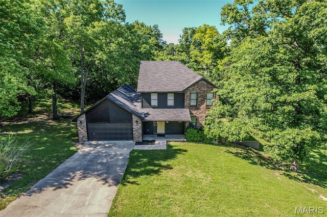 212 Tremont Dr, Waynesville, MO 65583 - view of front of property with concrete driveway, a front lawn, a garage, and stone siding