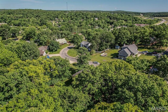 212 Tremont Dr, Waynesville, MO 65583 - aerial view of property and surrounding area with a heavily wooded area