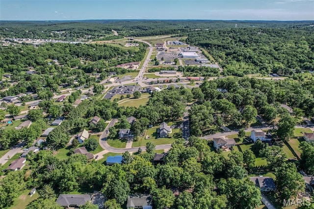 212 Tremont Dr, Waynesville, MO 65583 - aerial view of property and surrounding area with a heavily wooded area