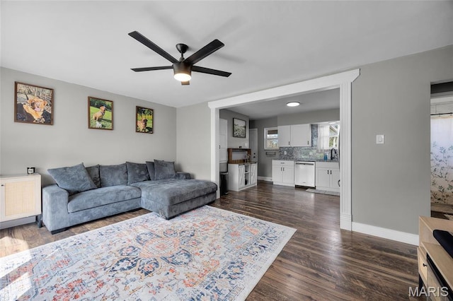 9748 Mackenzie Rd, Saint Louis, MO 63123 - living room with a ceiling fan, dark wood-type flooring, and baseboards