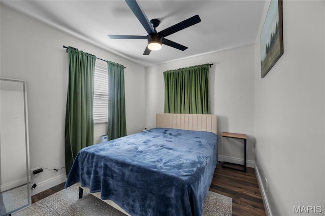 9748 Mackenzie Rd, Saint Louis, MO 63123 - bedroom with baseboards, wood finished floors, and ceiling fan