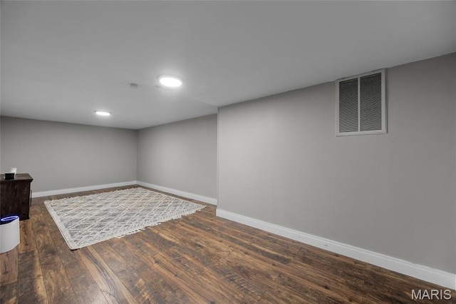 9748 Mackenzie Rd, Saint Louis, MO 63123 - finished basement with baseboards, hardwood / wood-style floors, and recessed lighting