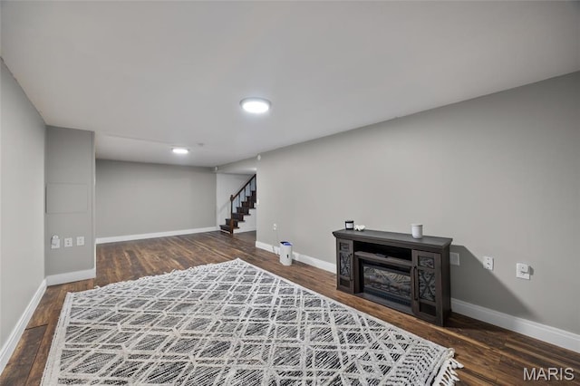9748 Mackenzie Rd, Saint Louis, MO 63123 - finished basement featuring baseboards, wood finished floors, stairs, and recessed lighting