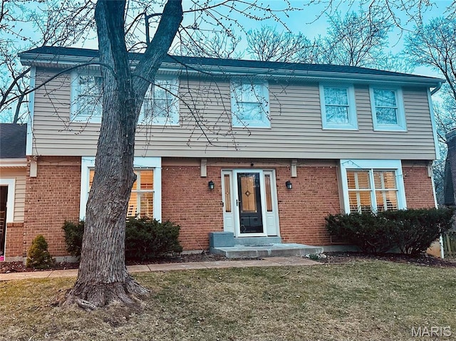 14964 Water Ridge Ct, Chesterfield, MO 63017 - colonial-style house with a front yard and brick siding