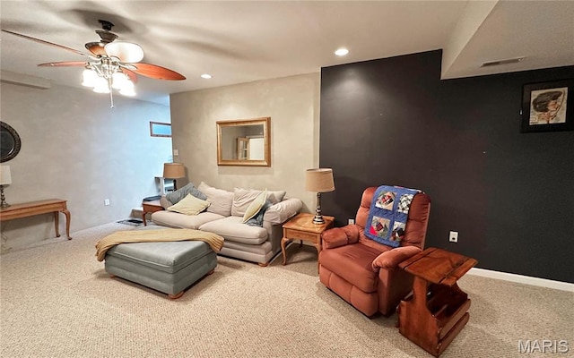 carpeted living area with a ceiling fan and recessed lighting