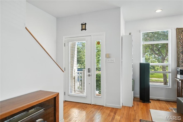 5784 Westminster Pl, Saint Louis, MO 63112 - foyer entrance with light wood-style flooring