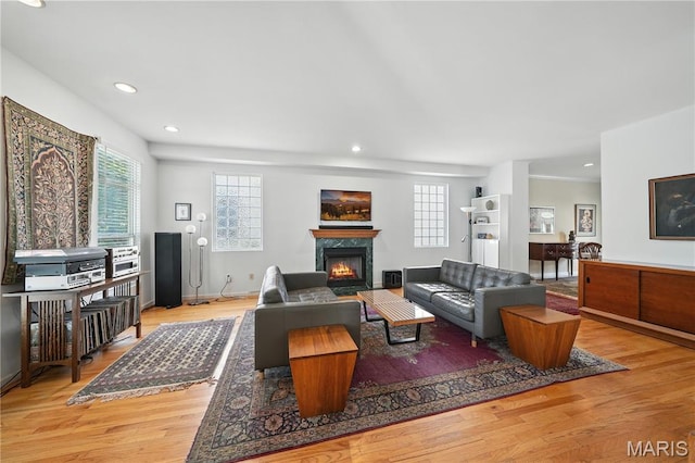 5784 Westminster Pl, Saint Louis, MO 63112 - living area with a fireplace, healthy amount of natural light, wood finished floors, and recessed lighting