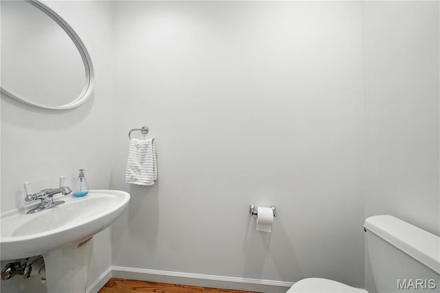 5784 Westminster Pl, Saint Louis, MO 63112 - half bath with toilet and a sink