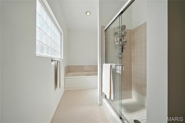 5784 Westminster Pl, Saint Louis, MO 63112 - bathroom with a shower stall, a garden tub, tile patterned flooring, and recessed lighting