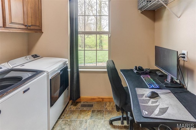 5829 Marine Rd, Alhambra, IL 62201 - laundry area with cabinet space, washing machine and clothes dryer, baseboards, stone finish floors, and an office area