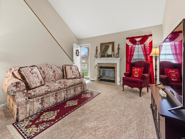 931 Georgetowne Dr, Ofallon, IL 62269 - living area with carpet flooring, vaulted ceiling, a tile fireplace, and baseboards