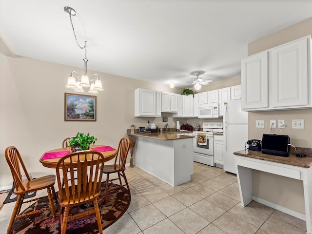 931 Georgetowne Dr, Ofallon, IL 62269 - kitchen featuring white appliances, a peninsula, light tile patterned floors, a chandelier, and a sink