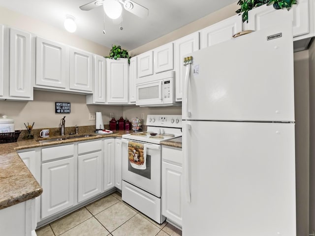 931 Georgetowne Dr, Ofallon, IL 62269 - kitchen featuring white appliances, a sink, light tile patterned floors, and white cabinetry
