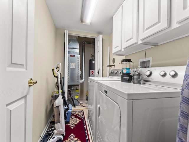 931 Georgetowne Dr, Ofallon, IL 62269 - washroom featuring washing machine and clothes dryer, cabinet space, and baseboards