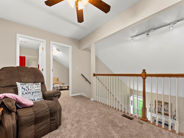 931 Georgetowne Dr, Ofallon, IL 62269 - living area with ceiling fan, carpet, lofted ceiling, track lighting, and an upstairs landing