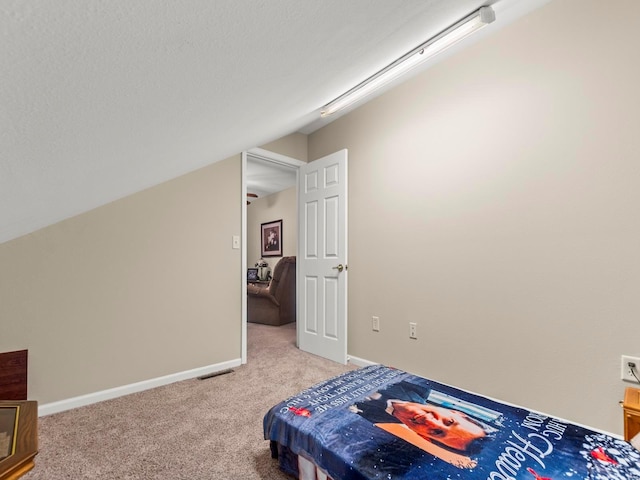 931 Georgetowne Dr, Ofallon, IL 62269 - bedroom with light colored carpet, baseboards, and vaulted ceiling