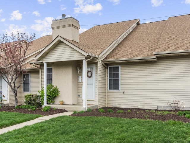931 Georgetowne Dr, Ofallon, IL 62269 - view of front facade featuring roof with shingles, a front yard, and a chimney