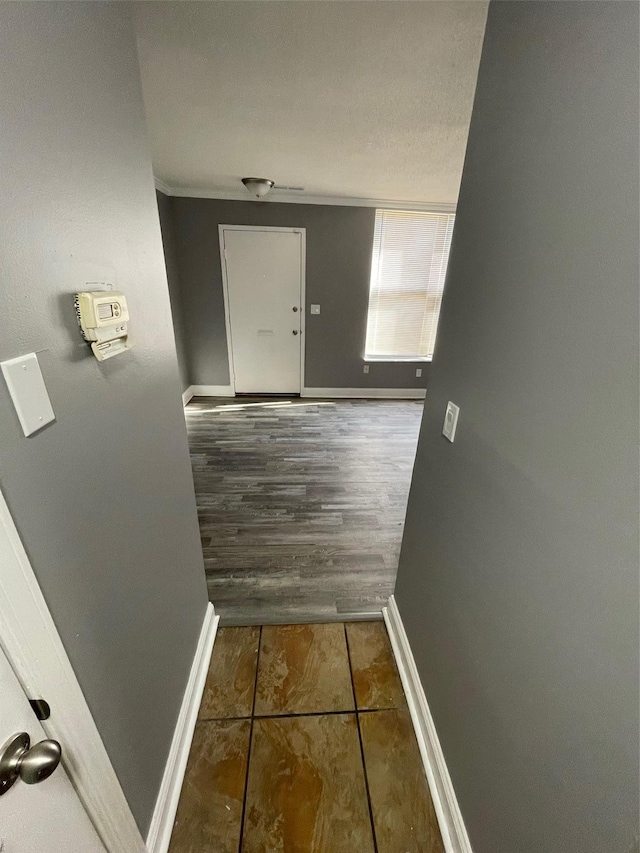 769 Walton Ave Unit 3, Saint Louis, MO 63108 - hallway with baseboards and tile patterned flooring