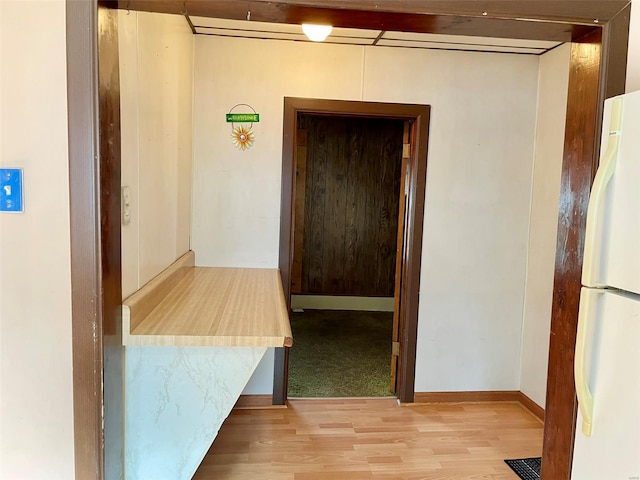 hall with wood finished floors