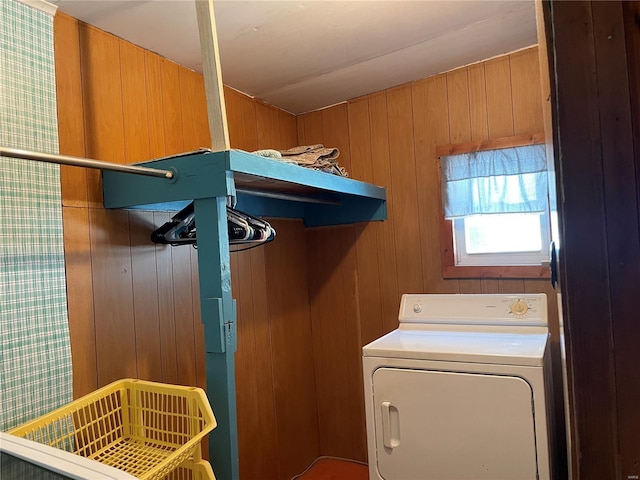 laundry room with washer / dryer and wood walls
