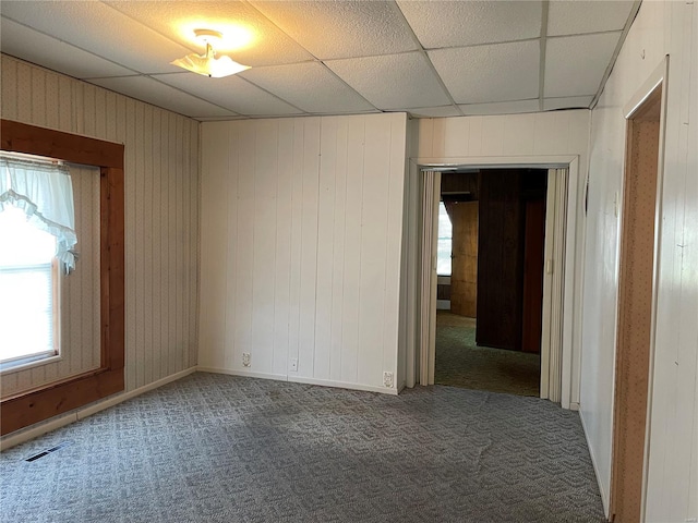 carpeted empty room featuring healthy amount of natural light