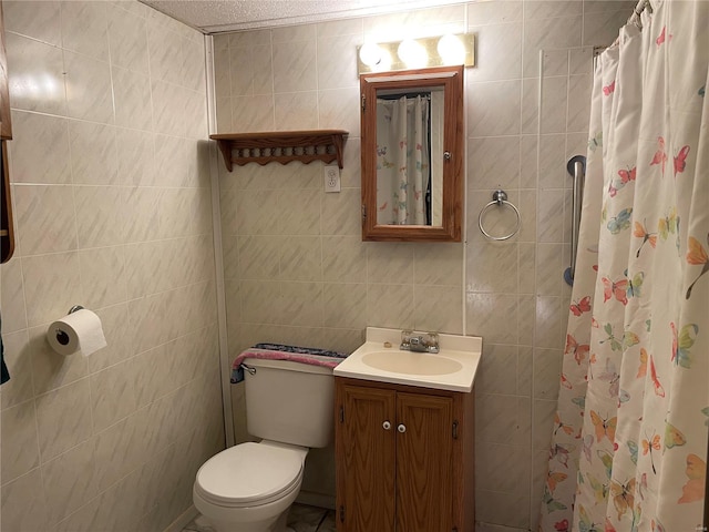 full bathroom featuring tile walls, vanity, toilet, and a shower with curtain