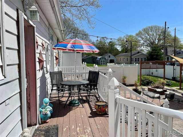 822 E Union Ave, Litchfield, IL 62056 - deck with outdoor dining area and a fenced backyard