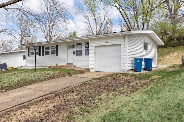 9218 Ellison Dr, Saint Louis, MO 63136 - ranch-style house with a garage, driveway, and a front lawn