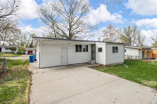 9218 Ellison Dr, Saint Louis, MO 63136 - rear view of property featuring entry steps and a patio area