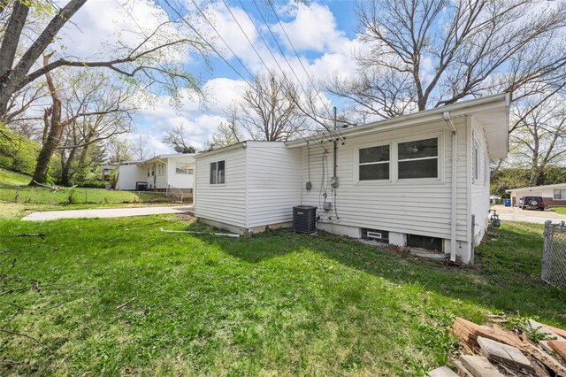 9218 Ellison Dr, Saint Louis, MO 63136 - rear view of house featuring central AC