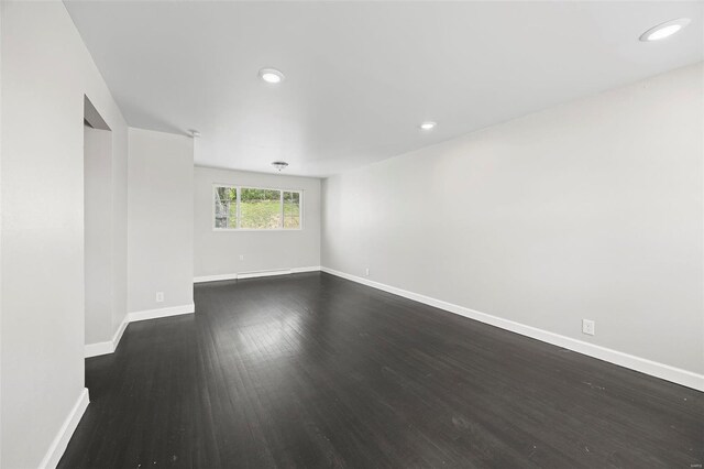 9218 Ellison Dr, Saint Louis, MO 63136 - spare room featuring baseboards, dark wood finished floors, and recessed lighting