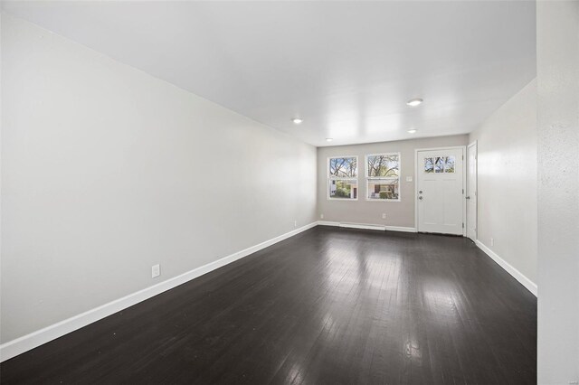 9218 Ellison Dr, Saint Louis, MO 63136 - empty room featuring dark wood-type flooring, baseboards, and recessed lighting