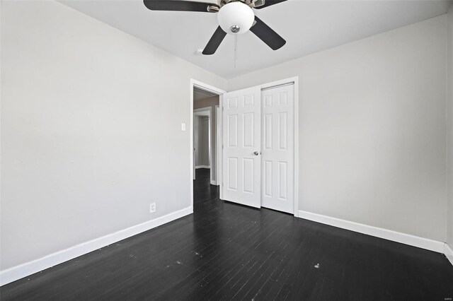 9218 Ellison Dr, Saint Louis, MO 63136 - unfurnished bedroom featuring baseboards, dark wood-style flooring, a closet, and a ceiling fan