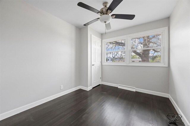 9218 Ellison Dr, Saint Louis, MO 63136 - spare room featuring baseboards, dark wood-style floors, and ceiling fan