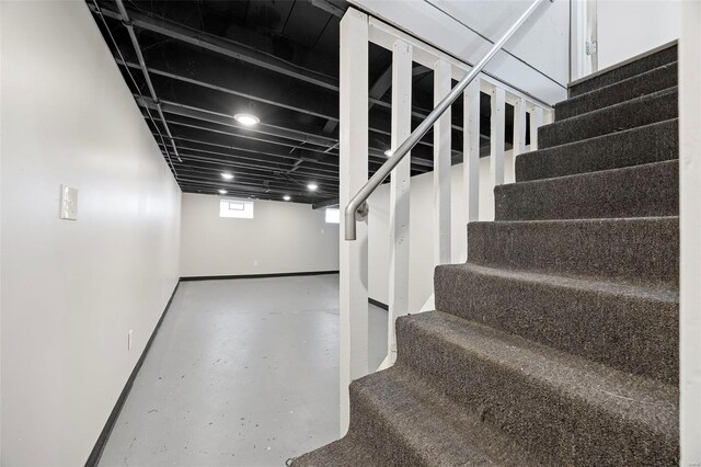 9218 Ellison Dr, Saint Louis, MO 63136 - below grade area with stairs and baseboards