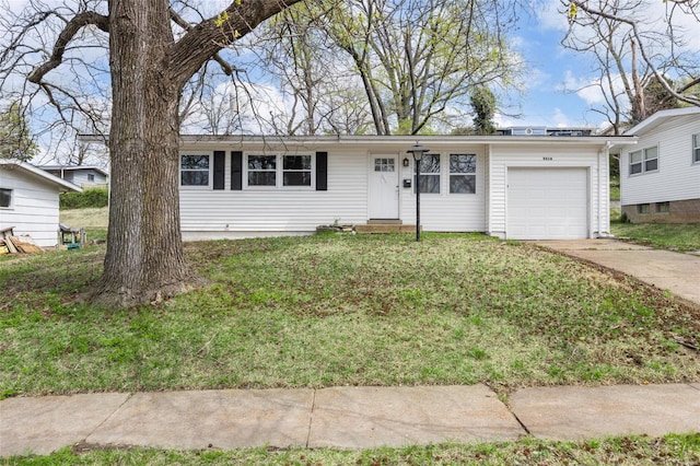 9218 Ellison Dr, Saint Louis, MO 63136 - ranch-style house with a garage, concrete driveway, and a front lawn