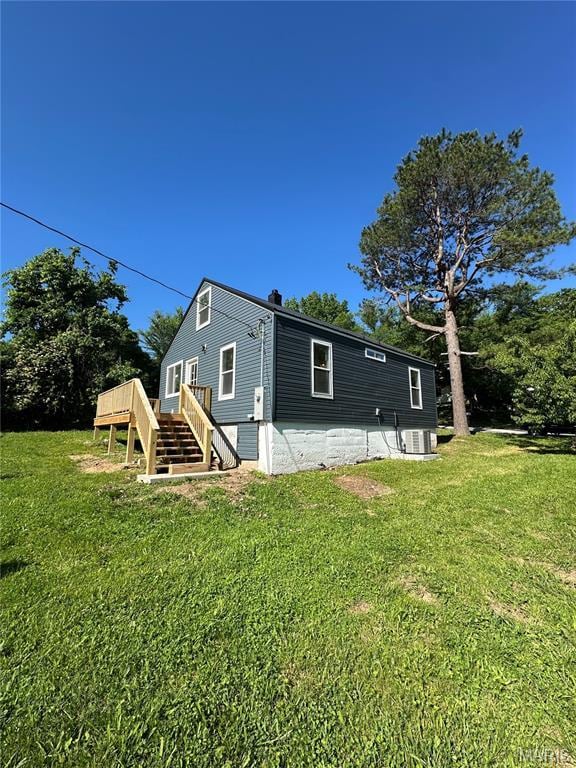 403 Broadway St, Waynesville, MO 65583 - rear view of house featuring a wooden deck, stairway, a yard, and central air condition unit