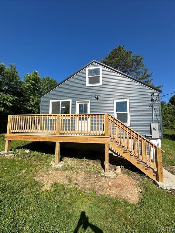 403 Broadway St, Waynesville, MO 65583 - back of property featuring a wooden deck and a yard