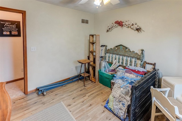 bedroom with wood finished floors, ceiling fan, and baseboards