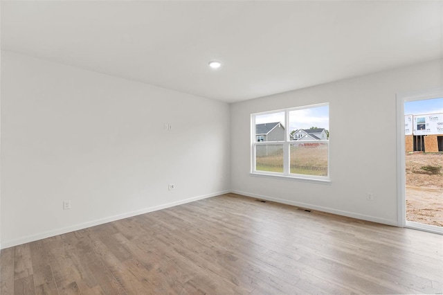 407 Fleming Cir, Wentzville, MO 63385 - unfurnished room with wood finished floors and baseboards