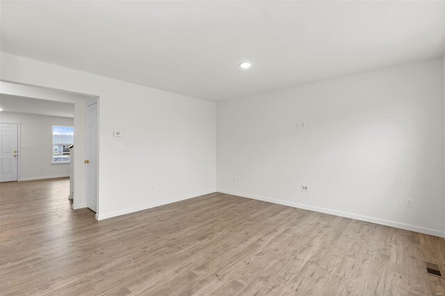 407 Fleming Cir, Wentzville, MO 63385 - unfurnished room featuring light wood-style flooring, baseboards, and recessed lighting