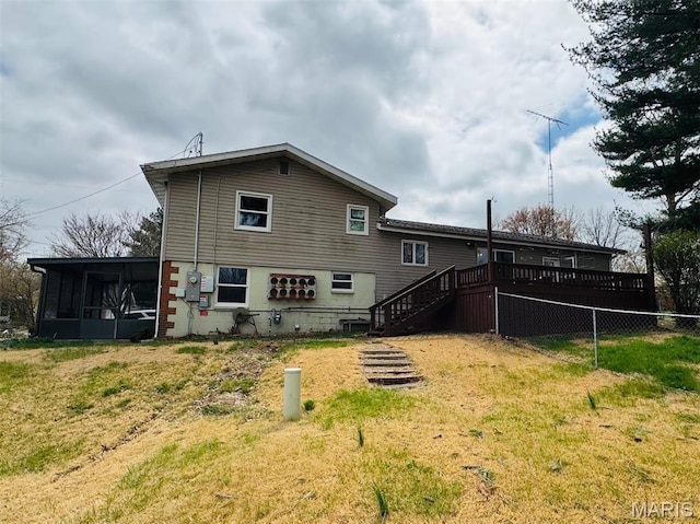 1423 Shelley Dr, Vandalia, IL 62471 - rear view of house with a sunroom, stairs, and a deck