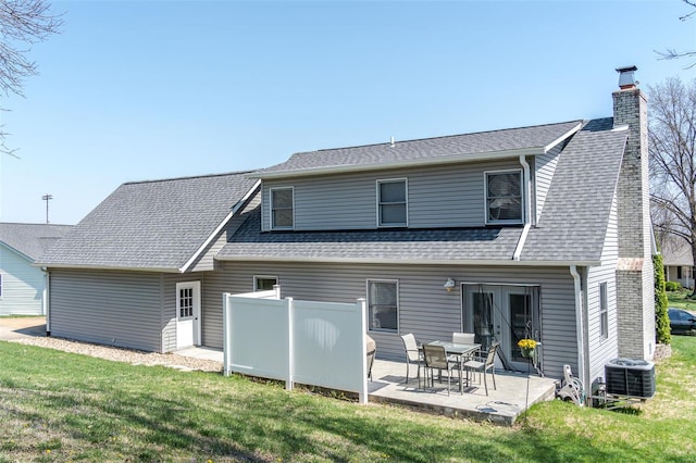 8 Nick Ridge Dr, Washington, MO 63090 - back of property with central air condition unit, a patio area, a lawn, and a chimney