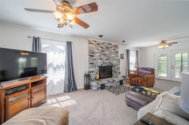8 Nick Ridge Dr, Washington, MO 63090 - carpeted living room with a ceiling fan, a brick fireplace, french doors, and baseboards