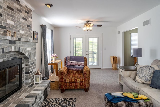 8 Nick Ridge Dr, Washington, MO 63090 - living room featuring carpet, french doors, a ceiling fan, and a fireplace