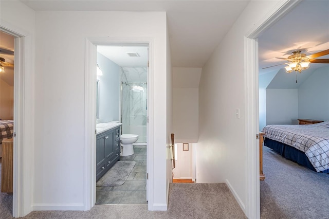 8 Nick Ridge Dr, Washington, MO 63090 - bedroom with light carpet, ensuite bathroom, baseboards, and ceiling fan